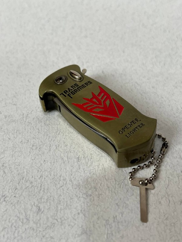 فندک اتمی دو کاره لایتر (LIGHTER) طرح ترنسفورمرز همراه با چاقوی ضامندار طلایی | فروشگاه بارزار