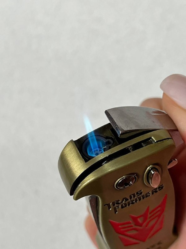 فندک اتمی دو کاره لایتر (LIGHTER) طرح ترنسفورمرز همراه با چاقوی ضامندار طلایی | فروشگاه بارزار