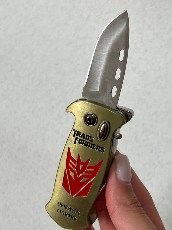 فندک اتمی دو کاره لایتر (LIGHTER) طرح ترنسفورمرز همراه با چاقوی ضامن‌دار طلایی | فروشگاه بارزار